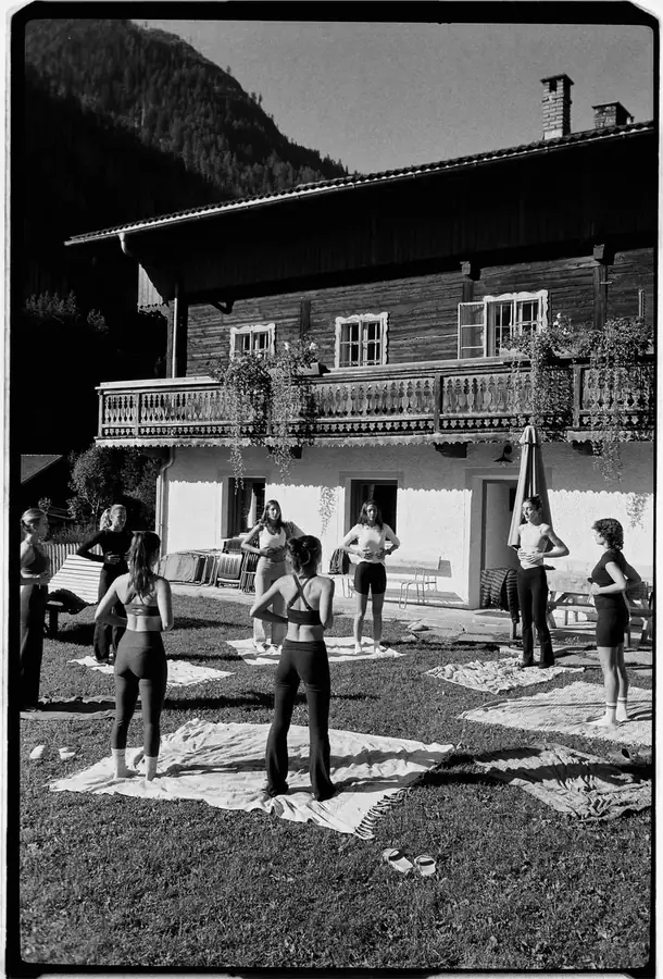 Film photo of a pilates class outside the chalet